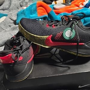 Nike Black and Red Sneakers with Gold Accents